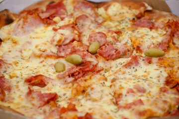 Large sliced Canadian chicken pizza with delicious flavor.
