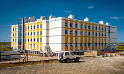 A school building in a northern settlement in the Arctic. Modern school education in the Far North of Russia. Ugolnye Kopi, Chukotka, Siberia, Russia.