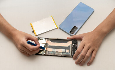 Close-up photos showing process of mobile phone repair