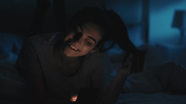 late online phone dependency night woman bedroom