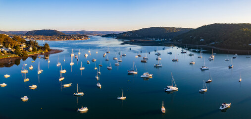 Early morning aerial waterscape panorama with boats
