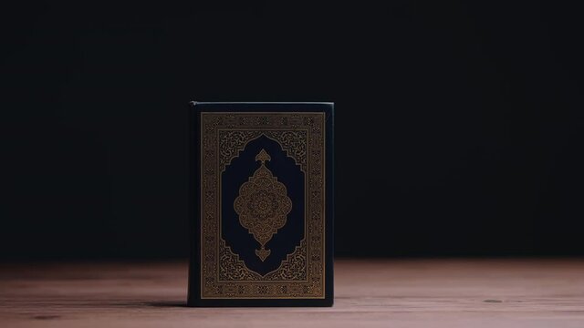 Islamic concept - The Holy Al Quran with written Arabic calligraphy meaning of Al Quran, Arabic word translation: The Holy Al Quran (holy book of Muslim), on black background