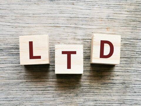 Acronym LTD on wooden cubes. Stand for LIMITED.