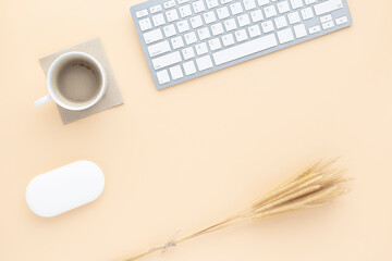 Office desk table top view with office supply, Beige table with copy space, Beige color workplace composition, flat lay