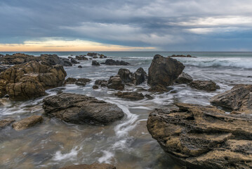 The incoming tide against rocks at Petrel Cove in South Australia