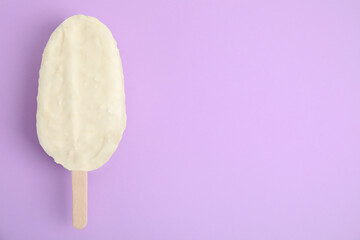 Ice cream with glaze on lilac background, top view. Space for text