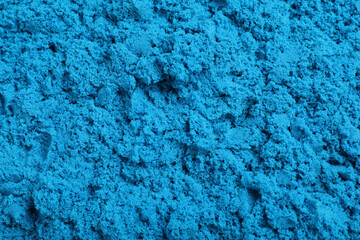 Fototapeta na wymiar Blue kinetic sand as background, closeup view