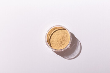 Mineral powder foundation isolated on a white background. Eco-friendly and organic beauty products