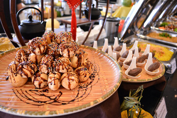 buffet party catering with lo hei yu sheng, asian and western cuisine, canapé and butler, dessert and drink halal menu for Chinese new year decoration celebrate fine dining at luxury hotel restaurant