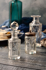 Vintage crystal bottles on the table close-up.