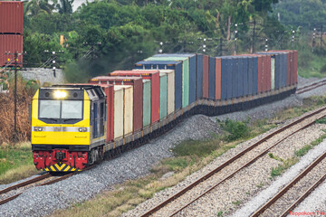 Container freight trains run on rails.