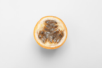 Half of granadilla on white background, top view