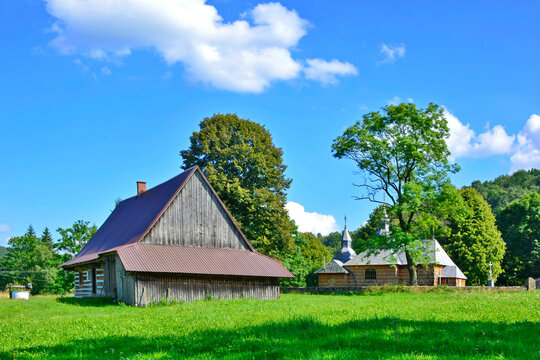 Traditional  village in Low Beskids with wooden orthodox church and lemko house, Olchowiec, Poland 