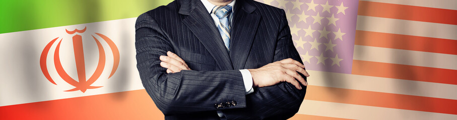 Businessman or politics against USA and Iran flag background