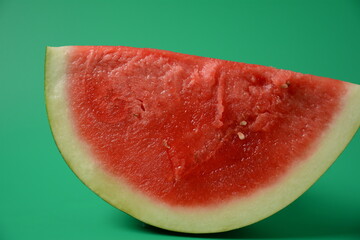 Fresh  watermelon quarter piece on bright background