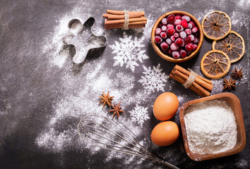 Christmas food. Ingredients for Christmas baking:  kitchen utensils, frozen cranberries, eggs, flour