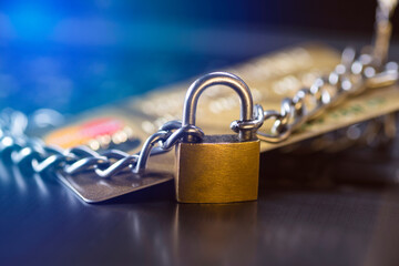 Credit card security, safe trading. Credit card closed with a padlock and chain