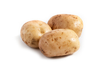 Three fresh white potatoes on a white background