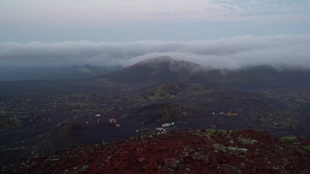 Timelapse video. Russia, Kamchatka. Cloudscape cover over the cones of the Tolbachik volcano.