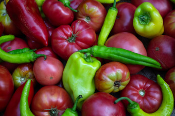Photo still life in a rustic style a harvest of tomatoes and peppers