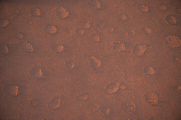 Abstract texture lines in the desert, close-up of arid land. Yellow background picture. The desert features of Africa.