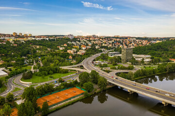 Aerial view of the bridge for cars in Prague, which connects Prague 7 Holesovice and Prague 8. Beautiful view of the city in a summer day.