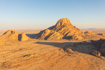 Naklejka na ściany i meble The natural scenery and arid environment of Namibia, Africa. Yellow background image.
