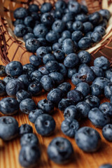 Bowl of fresh blueberries on rustic wooden table