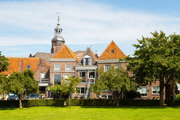 Old houses and church tower in the picturesque town of Blokzijl, Netherlands.