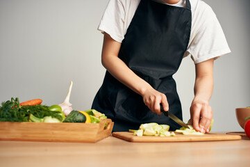 housewife cutting vegetables healthy eating vitamins in the kitchen