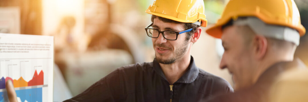 Panoramic of two Engineer are discuss with board of info graphic near by, Teamwork process planning and operation management shot.  