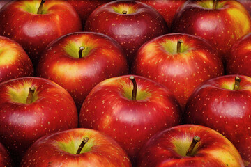 close up shot of a group of many freshness red apples with some yellow color marks