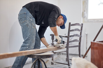 Young adult man working on a DIY budget renovation of his new home apartment.