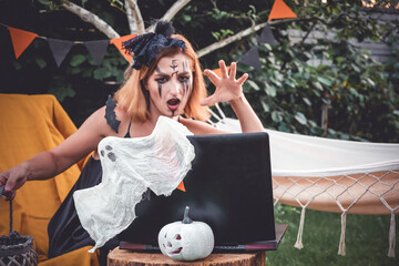 Halloween online virtual holiday remote celebration halloween in lockdown garden quarantine covid  new normal, social distance, remote communication,stay home vocation halloween selective focus
