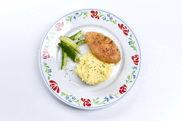 cutlet with mashed potato and cucumber