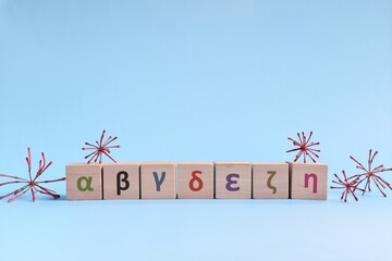 Covid-19 virus variants concept. Wooden blocks with greek letters representing coronavirus mutation.