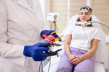 Patient brain testing using encephalography at medical center
