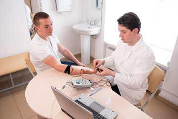 Patient nerves testing using electromyography at medical center