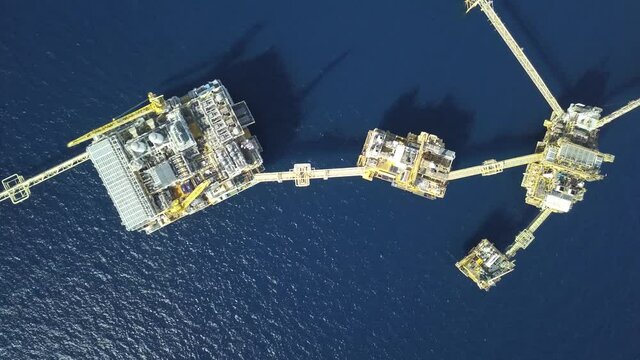 Central processing platform (cpp) in the middle of the ocean on sunny day - upstream industry
