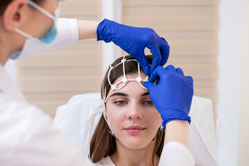 Patient brain testing using encephalography at medical center