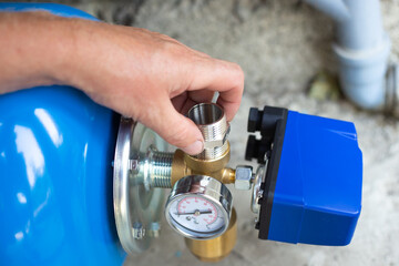 Pumping station. Installation of a water supply system in a residential building using a hydraulic...