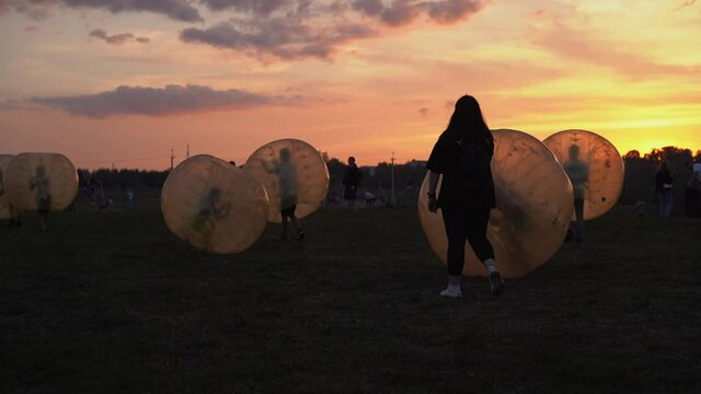 Children have fun in the Zorbing Ball. Selected focus