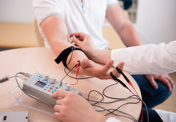 Patient nerves testing using electromyography at medical center