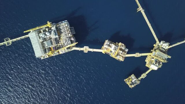 Central processing platform (cpp) in the middle of the ocean on sunny day - upstream industry
