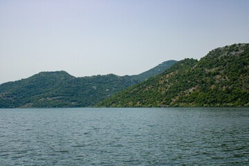 Croup of mountains around beautiful lake. Landscape on the natural park highlands. Panoramic view...