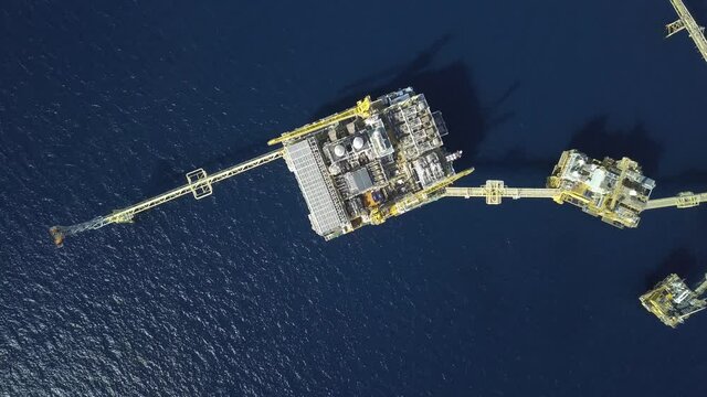 Central processing platform (cpp) in the middle of the ocean on sunny day - upstream industry
