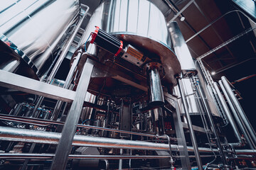 Rows of steel tanks for beer fermentation and maturation in a craft brewery