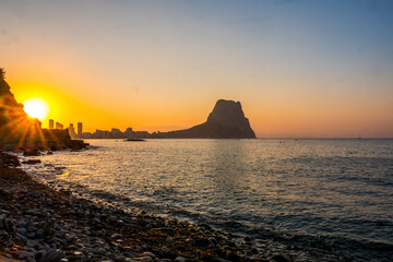 Calpe at sunrise on the Mediterranean coast of Alicante, Spain with views of the Ifach Rock