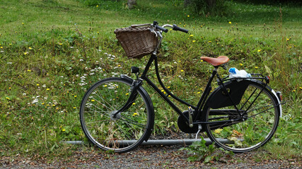 Fototapeta na wymiar bicycle in the grass in the country, Seydisfjordur, Iceland