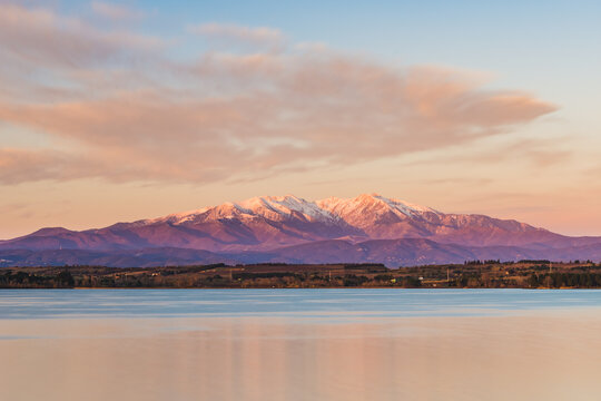 Beautiful sunrise at the lake (View of the Pic du Canigou, France Pyrenees Mountains)